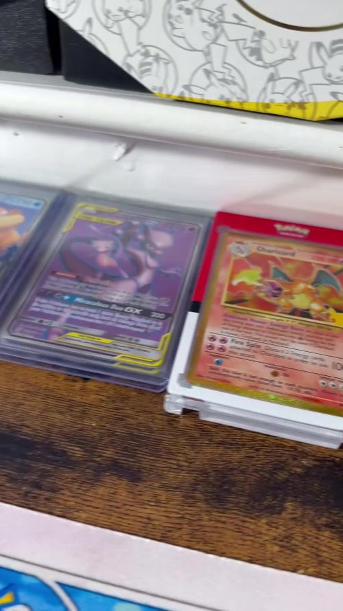 Video still showing cards from the seller's Pokémon collection; mystery bonus cards are not itemized